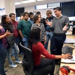 DAC Assistant Professors Dhruv Batra and Devi Parikh discuss their Visual Question Answering (VQA) project with students from thier Computer Vision Lab