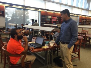 DAC Ph.D. student Rupinder Paul Khandpur (right) explaining the Open Jobs datasets he prepared for the Governor's Workforce Innovation Challenge. 